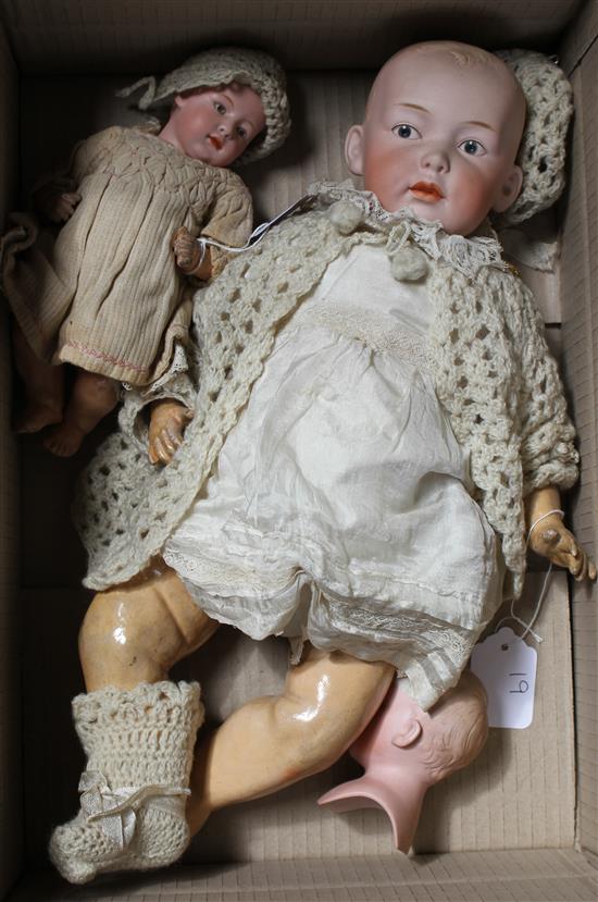 A Heubach character doll, intaglio eyes on shoulder plate broken, 18in., a Heubach character baby, intaglio eyes, hard body, 9in. and a